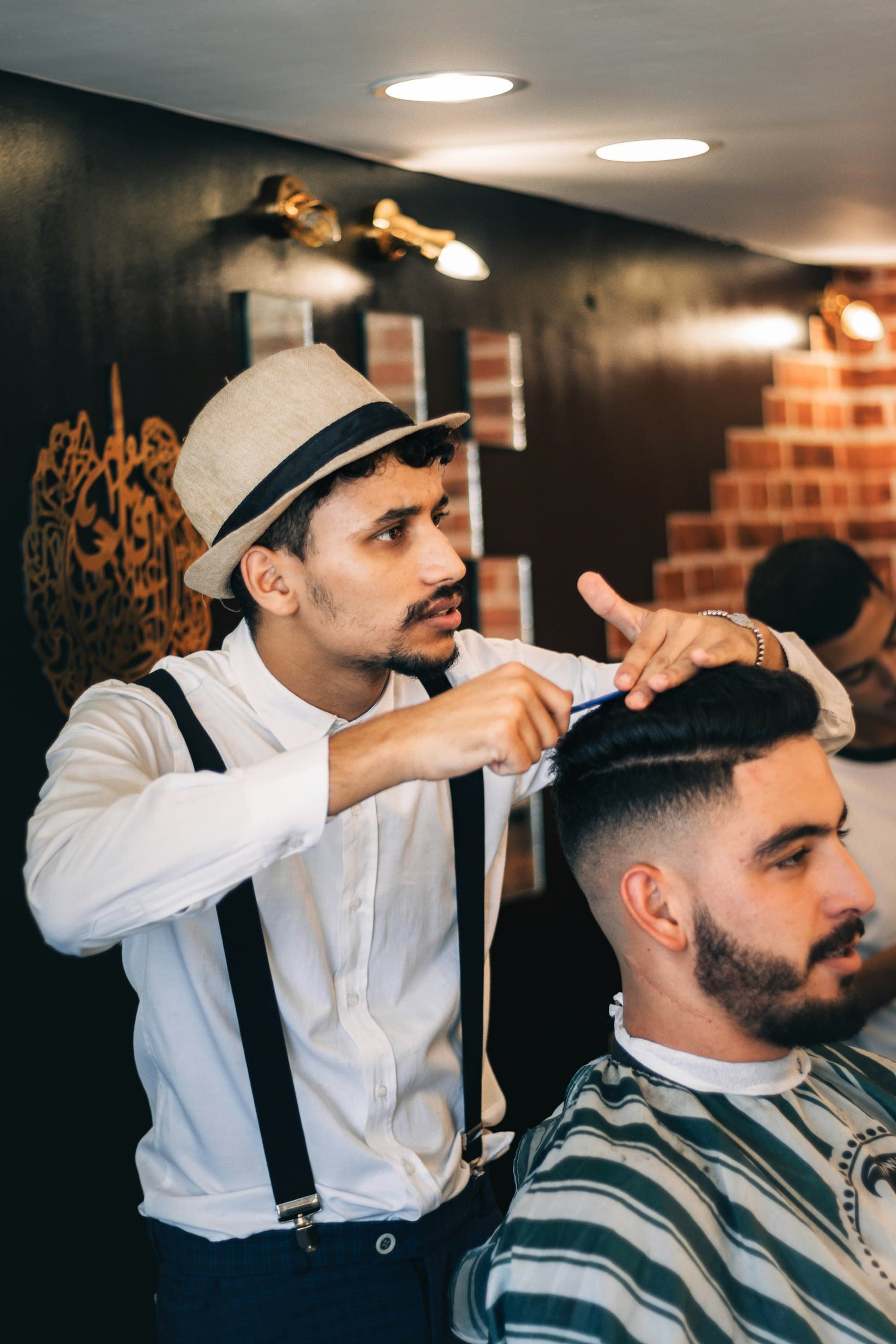 A salon owner with a client